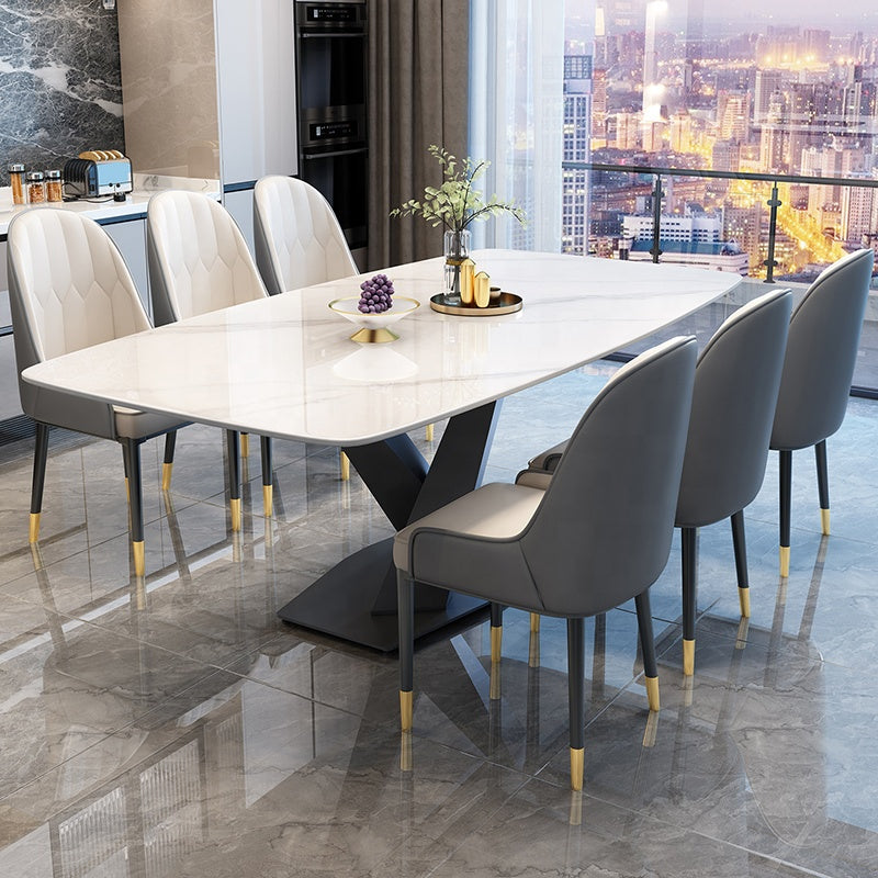 A luxury dining set featuring an extendable marble tabletop and a sleek metal frame, paired with eight stylish chairsample product