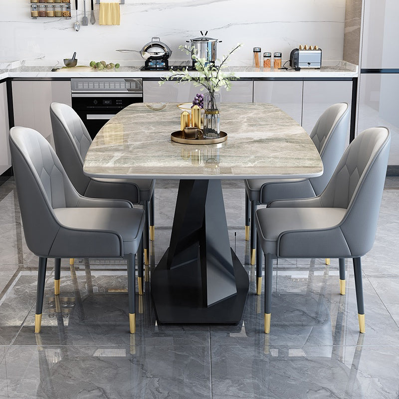 A luxury dining set featuring an extendable marble tabletop and a sleek metal frame, paired with eight stylish chairsample product
