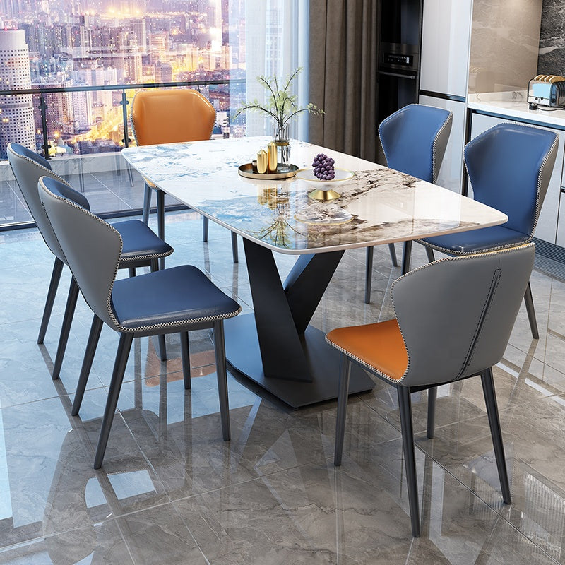 A luxury dining set featuring an extendable marble tabletop and a sleek metal frame, paired with eight stylish chairsample product